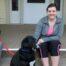 woman smiles for photo with dog - thanksgiving
