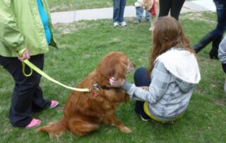 pet therapy dog with teen crouch together at ATD event