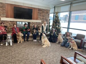 Alliance of Therapy Dogs group of dogs and volunteers spread holiday cheer at facility visit